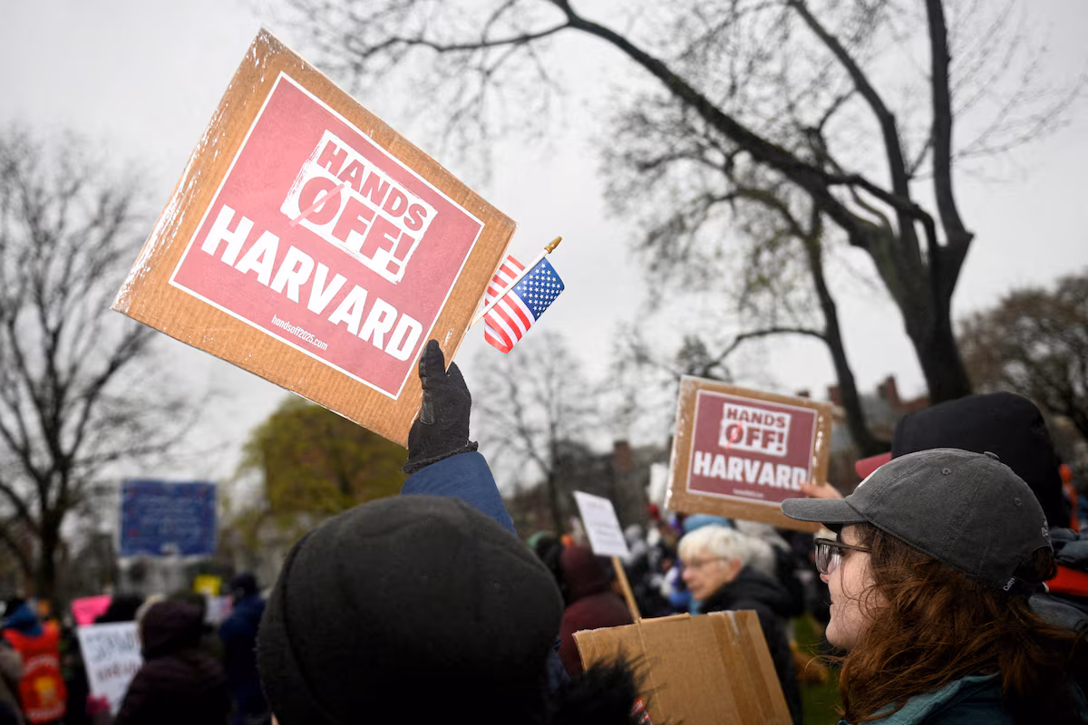 Demonstrators rally on Cambridge Common in a protest organized by the City of Cambridge calling on Harvard leadership to resist federal government interference at the university in Cambridge, Massachusetts, U.S.