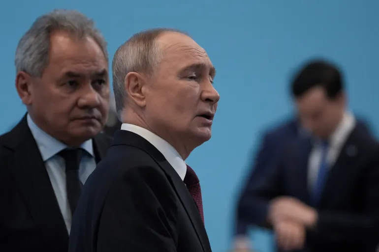 President Vladimir Putin, centre, has declared a temporary truce as Russia marks the end of World War II