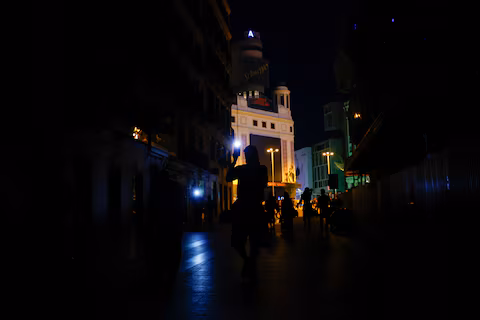 People use their mobile phone's flashlights to walk in the dark during a nationwide power outage in Madrid, Spain, April 28, 2025.