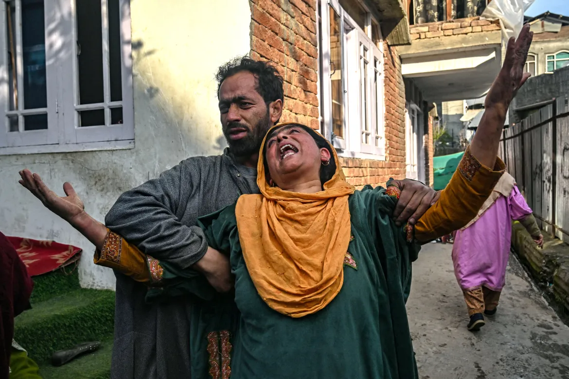 Relatives and neighbours of Ahsan Ul Haq Sheikh, who is suspected of involvement in the Pahalgam attack, mourn after their house was demolished in Murran village of Pulwama, south of Srinagar. [Tauseef Mustafa/AFP
