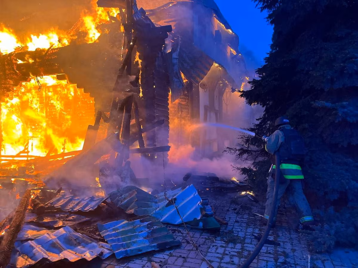 A rescuer works at a site of a Russian drone strike, amid Russia's attack on Ukraine, in Dnipro, Ukraine in this handout picture released April 30, 2025.