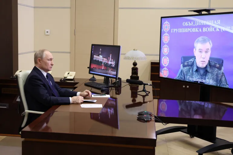 Russia's President Vladimir Putin listens to a report by Russia's Chief of Staff Valery Gerasimov via videolink at the Novo-Ogaryovo state residence outside Moscow, Russia, April 26