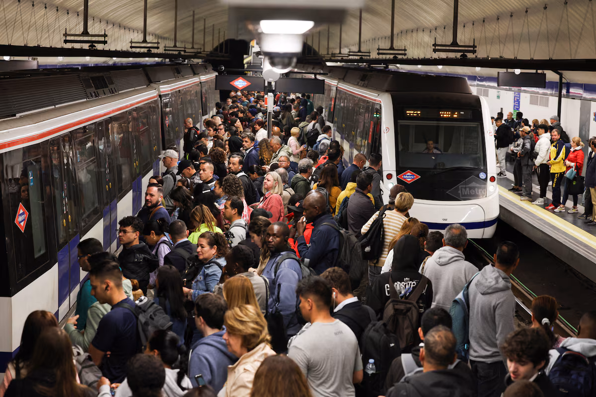 People wait on a platform as metro operations resume partially, after power begins to return following a huge outage that hit Spain and Portugal, in Madrid, Spain April 29, 2025.