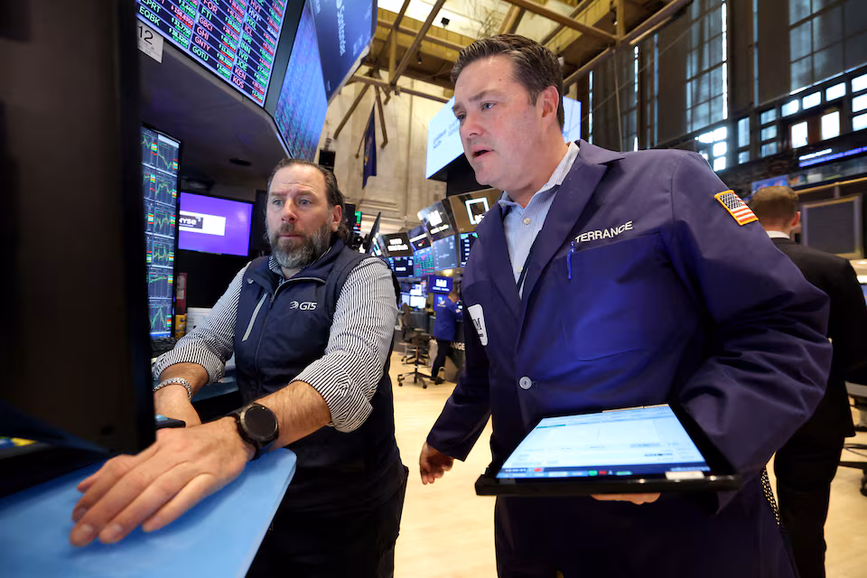 A trader works on the floor at the New York Stock Exchange (NYSE) in New York City, U.S., April 28, 2025